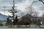 The Siskiyou and Cascade mountain ranges surround Grants Pass. Homeless residents shelter in tents in parks, including Morrison Park, despite the threat of civil and criminal penalties.