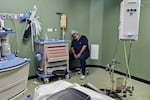 An hospital orderly rests on a chair at the end of a surgical operating theatre at Nasser Medical Complex in Khan Yunis in the southern Gaza Strip on Aug. 9, 2025. Gaza's hospitals have been experiencing shortages of food and essential supplies, including medicine and fuel, due to Israeli restrictions on the entry of supplies into the besieged Palestinian territory since the start of the war with Hamas in October 2023.