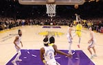 LeBron James of the Los Angeles Lakers scores on a jumper to oust another Laker great, Kareem Abdul-Jabbar, from the top spot as the NBA's all-time  leading scorer on Tuesday in Los Angeles.