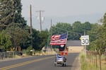 Fred Ingersoll, 72, rides his bike home from Walmart in Island City, Ore., on July 21, 2026.