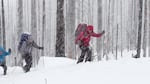 Andre Fortin and Jennifer Fortin skiing up to Tilly Jane.