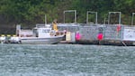 Government biologists take select sea lions from traps to be euthanized at Bonneville Dam.