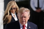 U.S. President Donald Trump is followed by White House Press Secretary Katie Zacharia (L) as he departs on the South Lawn of the White House on October 13, 2026 in Washington, DC.