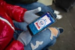 A immigrant from Venezuela tries in vain to access the CBP One app day a day after the second inauguration of U.S. President Donald Trump on January 21, 2025 in Nogales, Mexico.