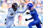 Oregon State wide receiver Trent Walker (7) tackles Boise State safety Ty Benefield (0) after a reception during the first half of an NCAA college football game on Friday, Nov. 29, 2024, in Boise, Idaho.