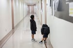 Children wait outside of an immigration court at the Jacob K. Javits Federal Building on July 31, 2026 in New York City.