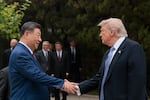 President Trump shakes hands with China's President Xi Jinping as he leaves after a visit to Zhongnanhai Garden in Beijing on May 15.