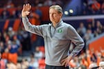 FILE - Oregon head coach Dana Altman motions to his team during an NCAA college basketball game against Illinois, March 3, 2026, in Champaign, Ill.