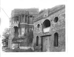 This undated photo shows Piggott's Castle sometime before 1932 (the year it received its first coat of paint), beside the property's original carriage house (right foreground), which no longer exists.