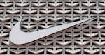 FILE - This Aug. 8, 2017 file photo shows the Nike logo at a store in Miami Beach, Fla.