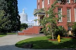 The Oregon Capitol sits just beyond Waller Hall on the campus of Willamette University in Salem, Ore., Wednesday, Aug. 7, 2019. The small private college was founded in 1842.