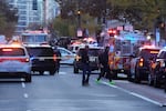 Emergency vehicles gather at a cordoned off area where National Guard soldiers appear to have been shot near the White House Wednesday, Nov. 26, 2025, in Washington.