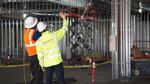 Workers examine the construction progress of the Cowltiz Tribe's Ilani casino and resort Monday, June 20, 2016.