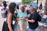 Bee Nguyen, left, talks to Carole Burton, center, and Tondalaire Ashford at a voting rights rally Saturday, May 16, 2026, in Montgomery, Ala.