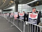 American Airlines pilots picket outside Chicago O'Hare airport on May 1, 2023, after voting to authorize a strike. They are now close to a deal that would give them substantial raises and quality of life improvements.