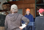 Emily Cooper, left, and her crew at a warehouse at Full Cellar Farm in Gresham, Ore., Oct 8, 2024.