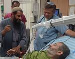 In this photo released by Soroka Medical Center on Tuesday, Aug. 27, 2024, Kaid Farhan Al-Qadi, 52, who was held hostage by Hamas militants in Gaza lies on a bed of the ‏Soroka Medical Center in Beersheba, Israel.