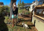 Misty Muñoz stands in front of her garden at Medford Estates on October 14, 2020. Muñoz says she doesn’t feel safe living amid dozens of destroyed mobile homes.