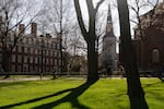 People walk through the campus of Harvard University in Cambridge, Massachusetts on April 17.