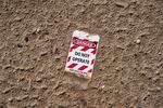 Debris seen near the launch pad has the words "Danger, do not operate" printed on it.