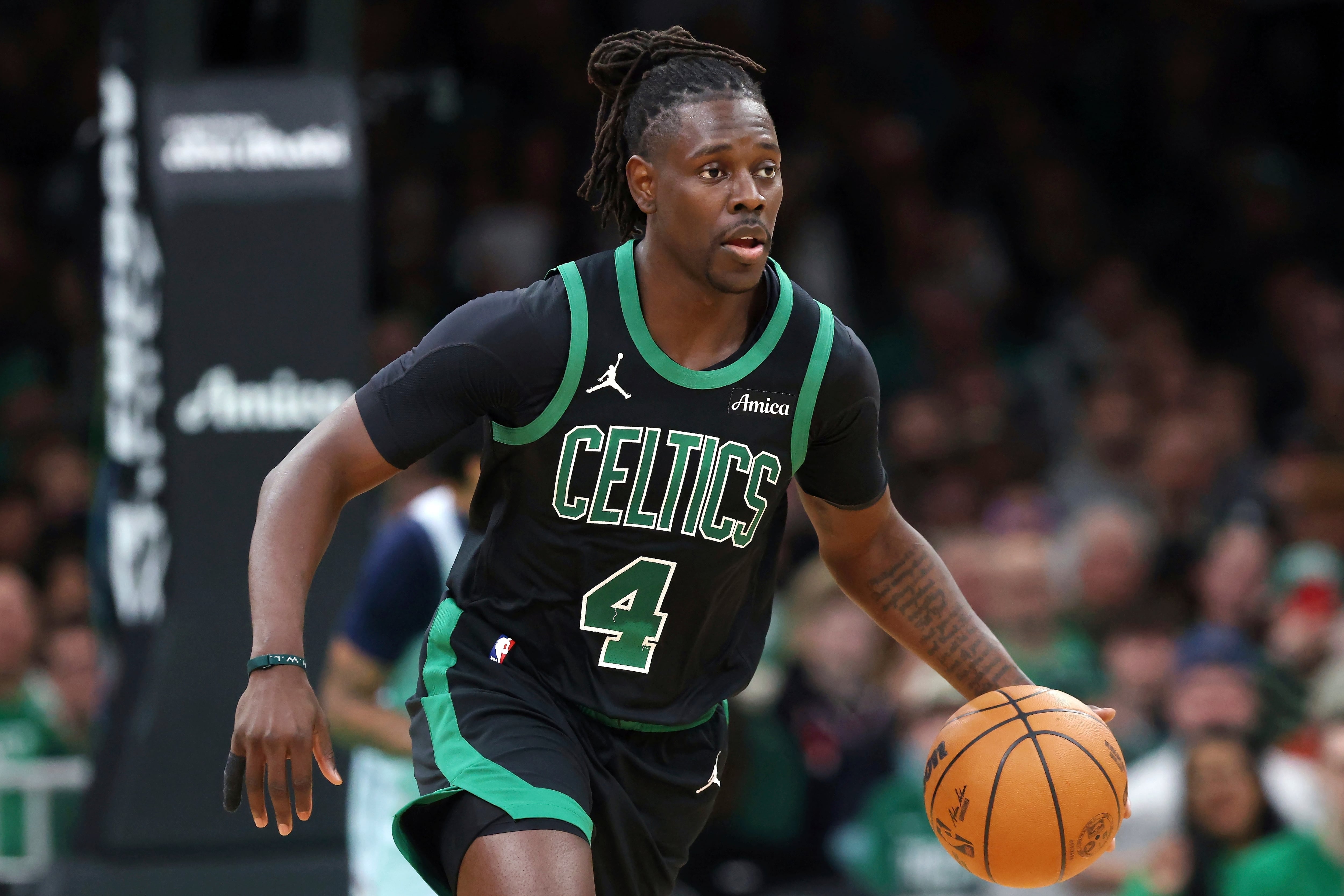 FILE - Boston Celtics' Jrue Holiday plays against the Washington Wizards during the first half of an NBA basketball game on April 6, 2025, in Boston. (AP Photo/Michael Dwyer, File)