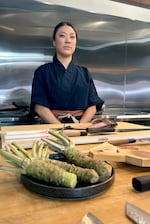 Sushi chef Kate Koo with a plate of fresh wasabi at the annual WasabiFest. Koo owns Zilla Sake and said at the start of her career, fresh wasabi rhizome was almost impossible to find in the U.S.