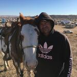 Ace Baker is a member of the Standing Rock Sioux who lives with his family on the Swinomish Reservation near La Conner, Washington. He is pictured here in November with his horse Hidalgo at a camp where Dakota Access Pipeline protesters were staying.