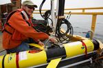 OSU oceanographer Jack Barth prepares a glider that will spend weeks flying through the ocean, collecting data on ocean acidification and oxygen levels.