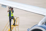 A technician prepares to refuel a plane at Austin-Bergstrom International Airport in April.