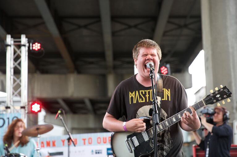 Ethan Conrad, singer and guitarist of doom metal band Saola, belts out deep growls on the West Stage. PDX Pop Now! hosts more than 40 bands playing on two stages underneath the Hawthorne Bridge all weekend.