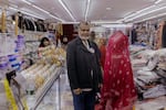 Mithu Ahmed, 60, a local business owner in Jackson Heights, stands for a portrait inside his store in Diversity Plaza.