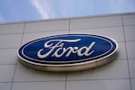 The Ford logo is seen above the entrance to the Ford Motor Company Kentucky Truck Plant in Louisville, Ky.