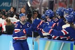 Hilary Knight #21 of the United States celebrates with teammates after scoring a goal late in the third period to even the score 1-1 during the women's gold medal match between the U.S. and Canada at the 2026 Winter Olympics on Thursday.