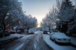 A side street in Southeast Portland is dusted with a few inches of snow and crusted over with ice on the morning of Wednesday, Feb. 21, 2018.