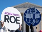 Anti-abortion rights activists counter-demonstrate as abortion rights activists participate in a "flash mob" demonstration outside the Supreme Court on Jan. 22 in Washington, D.C.