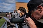 Sandy Boisen, center, and Jack Boisen, right, observe wildlife from an observation deck at the Tualatin River National Wildlife Refuge on March 14, 2026.