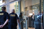 In this Sept. 13, 2016, file photo, people enter the Mark O. Hatfield United States Courthouse in Portland, Ore. Law enforcement officials in Oregon say they've uncovered an elaborate scheme to circumvent Chinese banking laws.