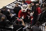 A fan poses for a photo with Blaze, the Portland Trail Blazers mascot on April 2, 2016.