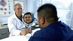 Fred Harwin and patient Arturo Lucatero with his new ocular prosthetic.