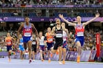 Cole Hocker, of the United States, celebrates after winning the men's 1,500 meters final at the 2024 Summer Olympics, Tuesday, Aug. 6, 2024, in Saint-Denis, France.