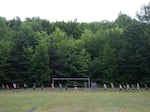 Older boys run laps on the sportova ploshta, or "sports field."