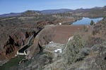 FILE - The Iron Gate Dam powerhouse and spillway are seen on the lower Klamath River near Hornbrook, Calif., March 2, 2020.