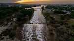The sun sets over the Guadalupe River in Texas.