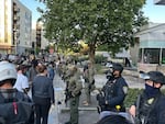 Federal officers guard the ICE facility in Southwest Portland, Ore., on June 14, 2025. The demonstration, which was declared a riot by the Portland police, saw numerous confrontations between protesters and federal officers, with repeated use of crowd control munitions.