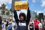 Paul Ivanov chants during a protest against the Trump administration on Saturday in Miami.