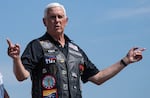 Former Vice President Mike Pence speaks to a crowd of motorcycle riders and the press before riding a motorcycle to the Iowa state fairgrounds for Iowa GOP Sen. Joni Ernst's Roast and Ride fundraiser on June 3.