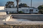 A swimming pool lies empty in the town of Kleinzee in the Namaqualand region of South Africa. The town was once the property of the De Beers diamond company. In its heyday, it was a thriving settlement of 4,000 people with about 30 recreational clubs. After closing down its mines in the region, De Beers sold off the town, which is now largely empty.