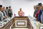 Nepal's newly appointed interim prime minister, Sushila Karki, along with officials, observes a moment of silence for the people who died in recent protests, on Sept. 14.