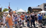 A crowd and one of the Kinetic Kops wait to watch the start of The Graand Kinetic Challenge, July 18, 2026.