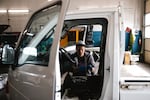 Gregory Miller, services and parts manager, works to rebuild a carburetor on a 1998 Japanese kei truck, on Tuesday, May 13, 2025, at JDM Car & Motorcycle in Shoreline, Wash.